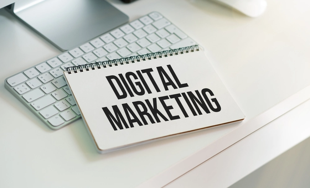 Notebook with Tools and Notes about Digital Marketing, concept